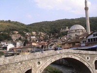 Beautiful old bridge in Prizren, Kosovo. A ruined Serb neighborhood is in the hills. 