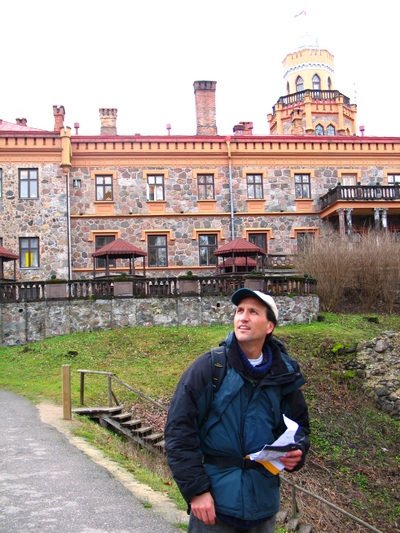 Francis Tapon being a tourist - observing everything in Latvia with a map in hand