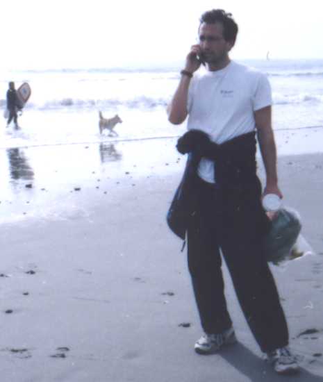 Believe it or not, I was working on the beach. But that surfer and that dog were having a lot more fun than I was. 