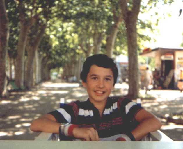 Summer 1983. I was 13-years old in this shot. I was relaxing in some outdoor cafe in France. I just finished an ice cream and have a happy look in my face.