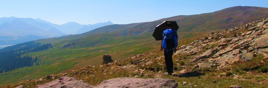 The most uncomfortable position to hold an umbrella is when the sun is facing you and is low in the sky. It forces you to block most of your view, but fortunately it rarely lasts long.