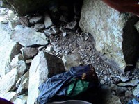 This is where I slept: between a rock and a hard place. It was a small cave. I was above the tree line so there was no place to put my tarp. 
