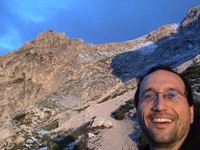 It was about 5AM when I took this self-portrait. I had slept outside just at the tree line. Near, but not in, a cabin. My tarp provided my shelter.