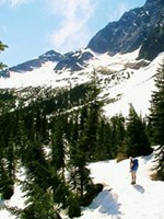 Maiu in awe at the impressive task before us: blaze a trail through the snow to climb over Suiattle Pass. This was the snow coverage at the end of June 2006 in Washington.