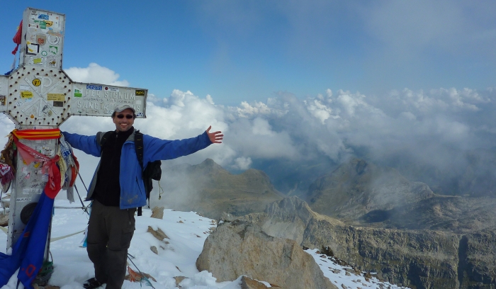 Francis Tapon on the summit of Aneto with the cross at 3,404 meters or 11,168 feet