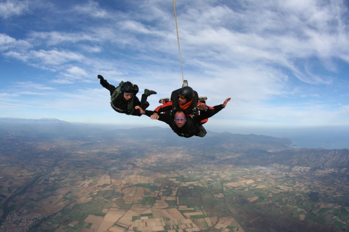 Three falling skydivers