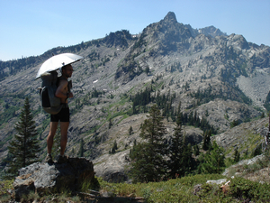Overlooking the Trinity Alps with an umbrella on California's PCT