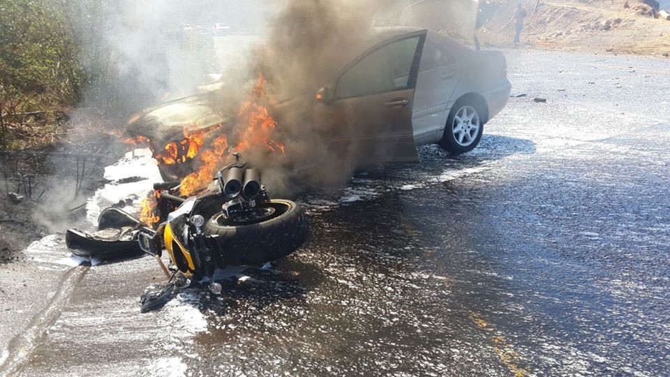 Motorcycle blown up and on fire in a major accident