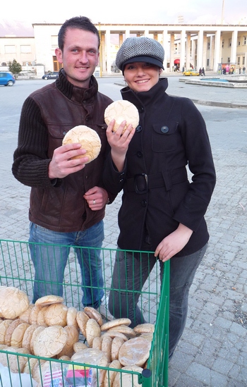 Albanian couple selling a sweet bread in Tirana, the capital of Albania