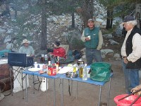 You'd think we were car camping, but we were in the middle of nowhere in Yosemite. They had tables, a full bottle of olive oil, coffee, a heavy white canister with propane (below the table), a mattress, 15 pairs of underwear, and enough fresh food to feed an army of thru-hikers. It took them three hours to load everything on their three horses and five mules. 