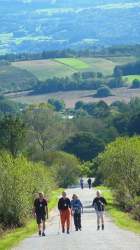 Pilgrims walking on of El Camino many paved, but deserted, roads. The surrounding farmland is nice to look at for a few days, but then gets boring.